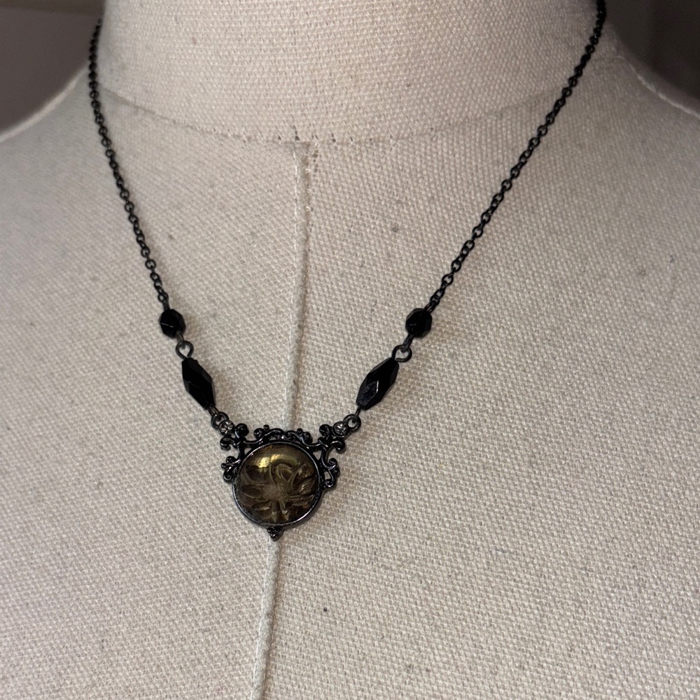 1928 Black and Gold Necklace with flower inside